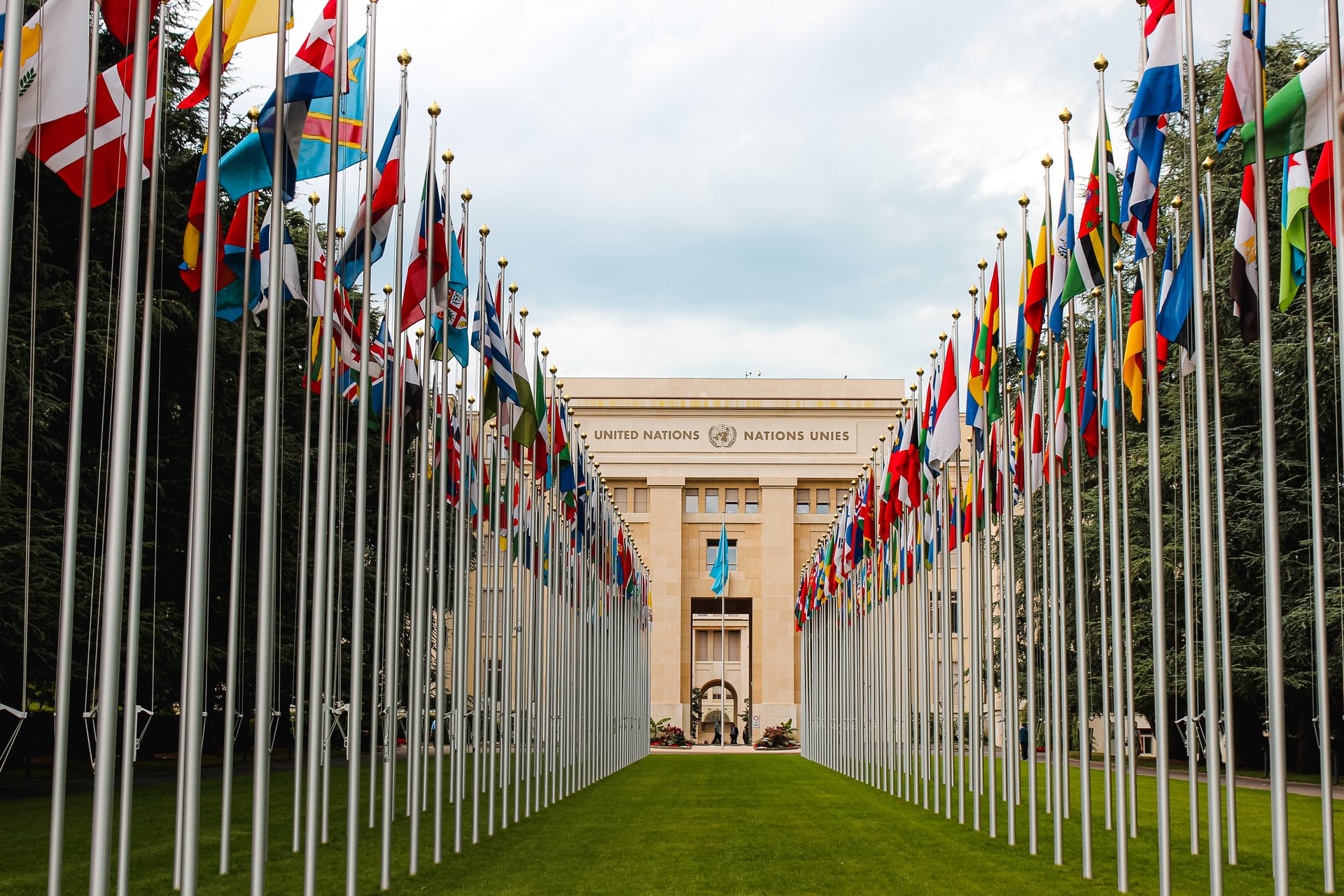 Flags of United Nations members on the lawn of the UN building in Geneva, Switzerland.
